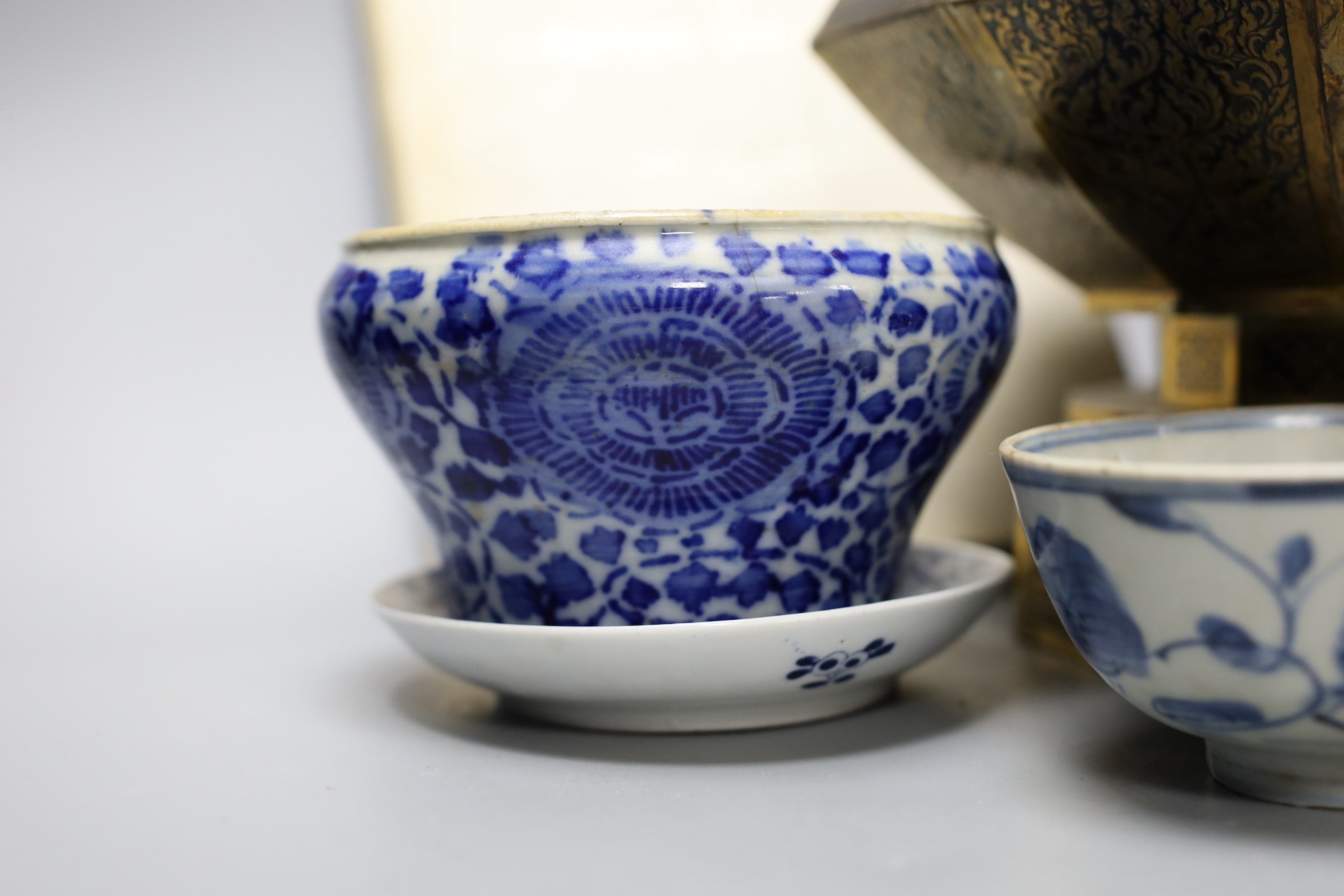 A collection of Chinese blue and white tea bowls, a vase, metal planter and book on Hong Kong by John and Veronica Stericker, (7)